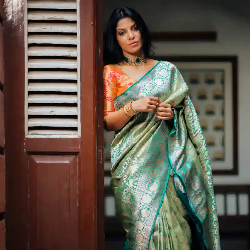 4. The Enigmatic Green Banarasi Silk Saree With Dual Tone: 